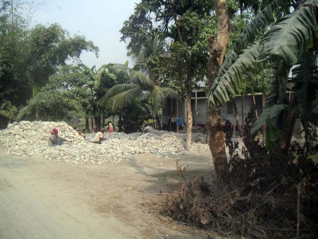 Villagers breaking stones