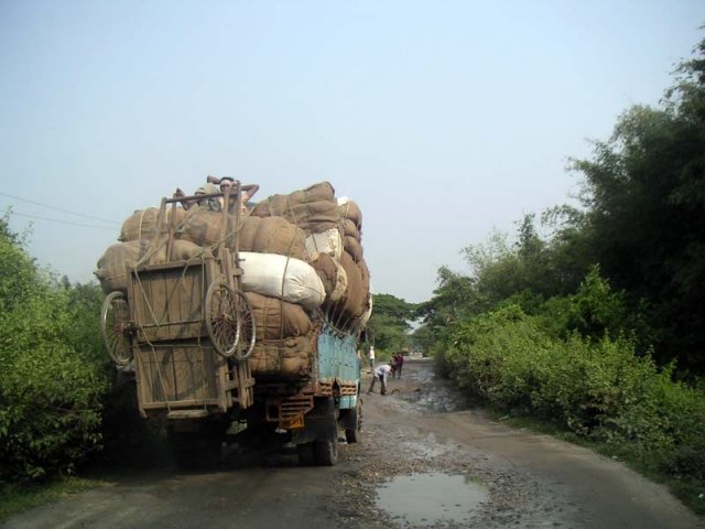 Driver making repairs to road